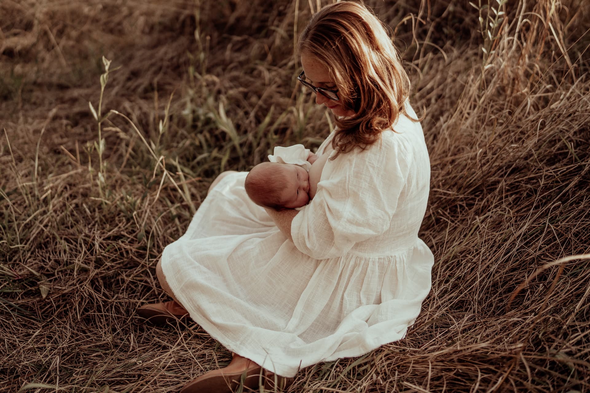 Dr Jocelyn Ledger holding her baby outdoors
